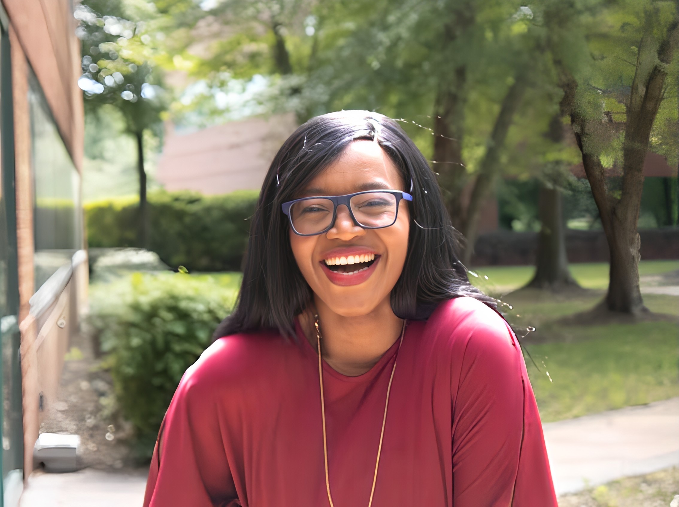 Dr. Lilly Mbinglo laughing outdoors