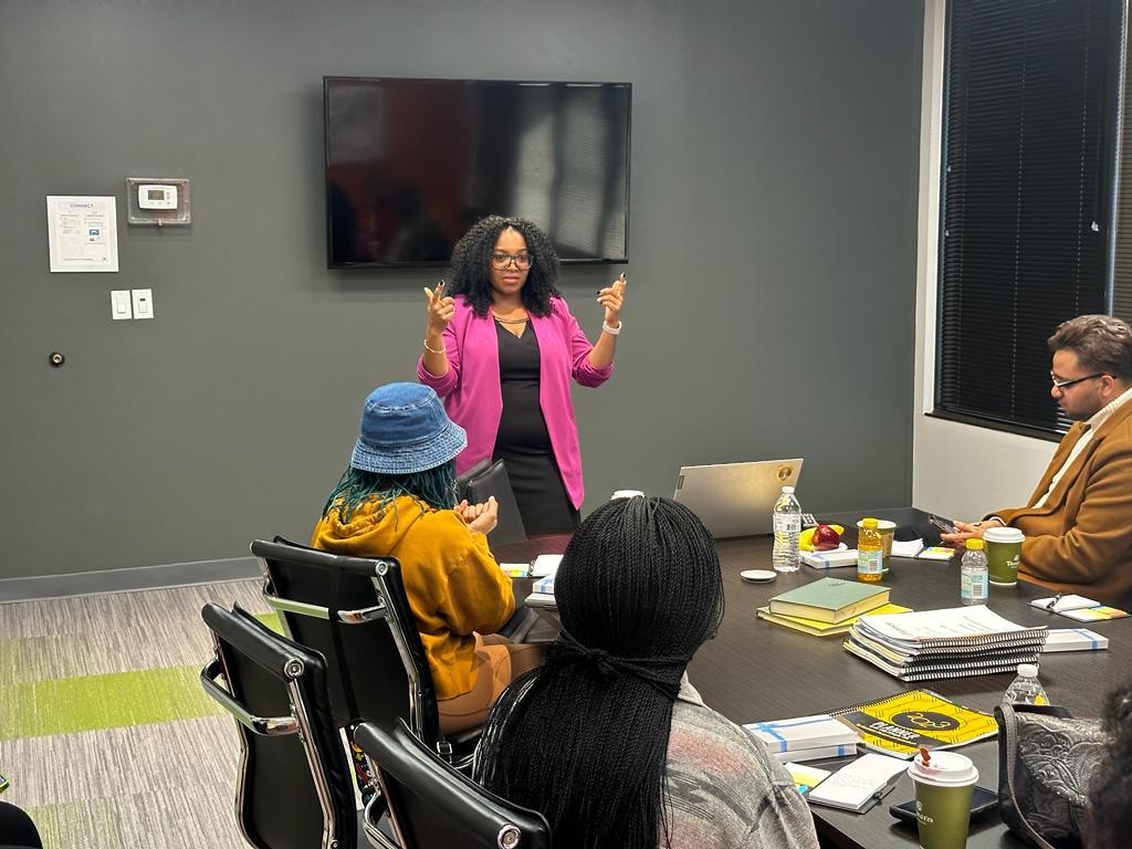 Dr. Lilly Mbinglo teaching a seated workshop audience