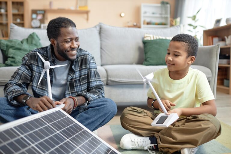 Father teaching kid renewable energy