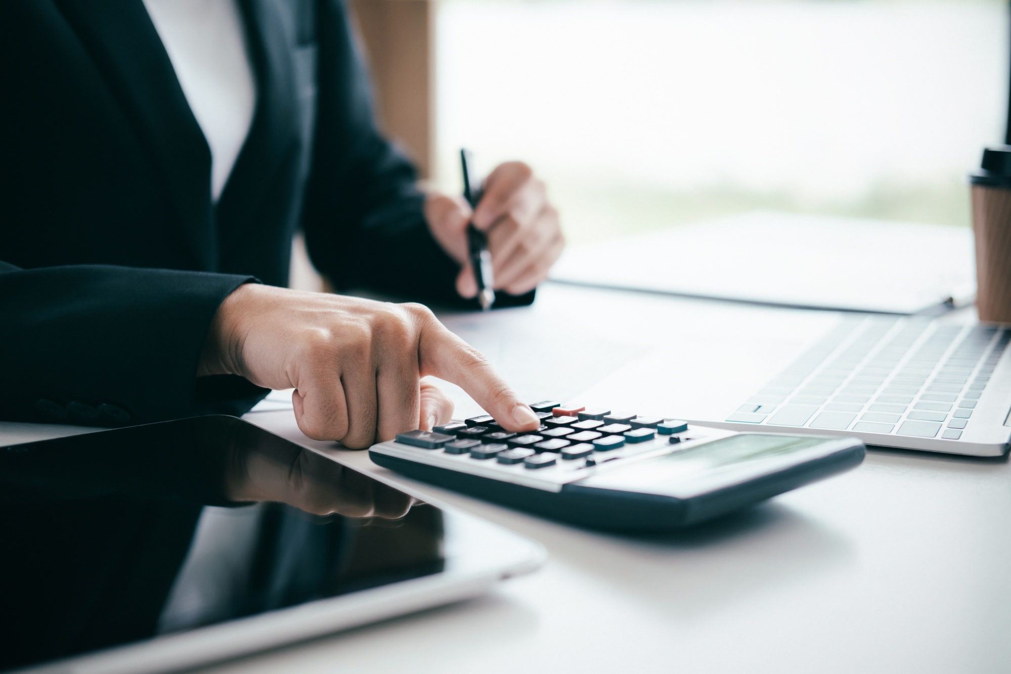Business accountant is calculate the budget.